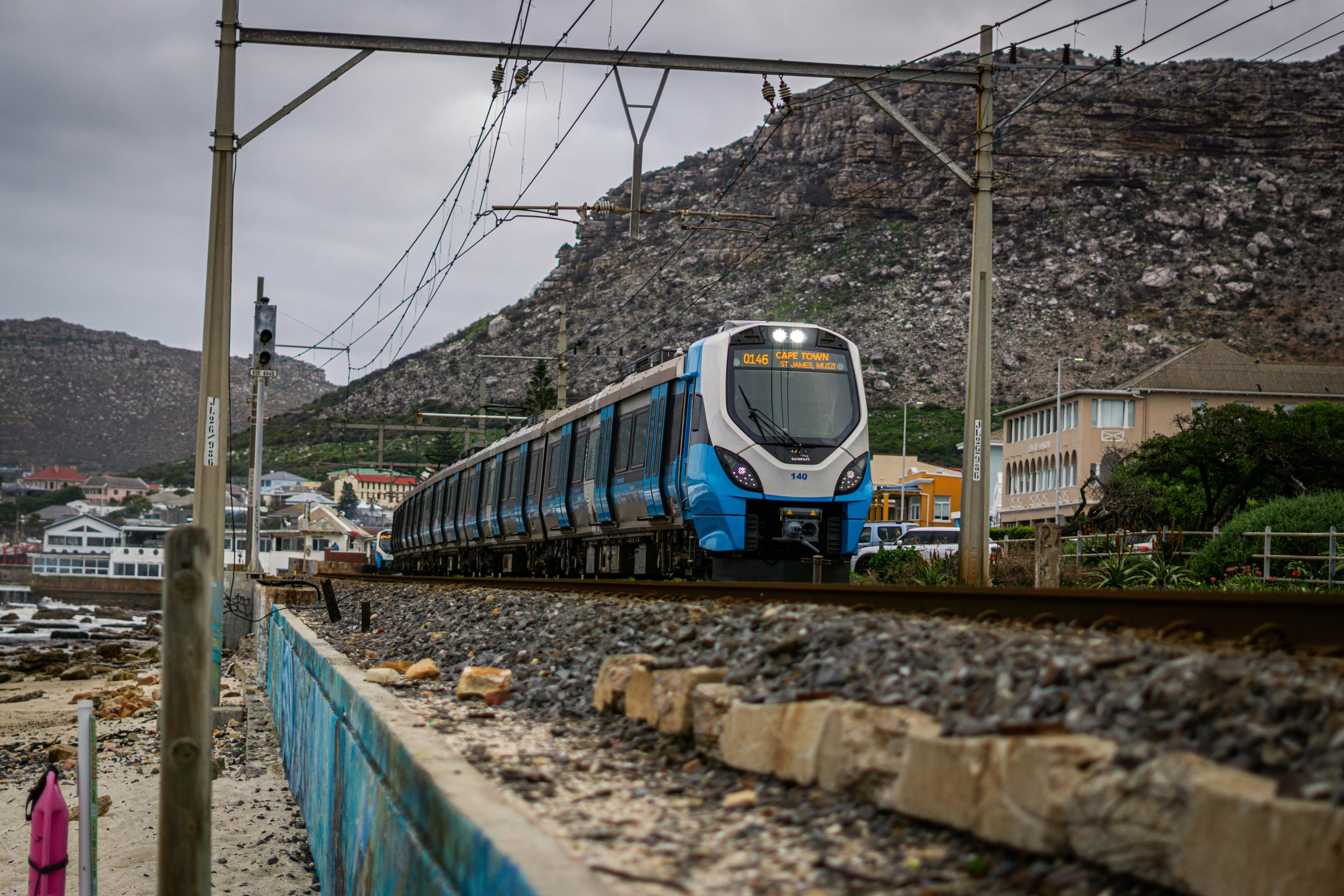 Train on a rail line secured by fencing
